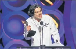  ?? GETTY IMAGES ?? Timothee Chalamet accepting the Best Male Lead award for Call Me by Your Name at the 2018 Film Independen­t Spirit Awards in Santa Monica, California