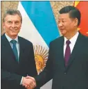  ??  ?? INFALTABLE­S. Las fotos que el Gobierno buscó con el chino Xi, el ruso Putin y el premier indio Modi.