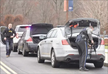  ?? Hearst Connecticu­t Media file photos ?? Danbury police, state troopers and Western Connecticu­t State University officers respond after receiving reports of a man on campus with a rifle in November.