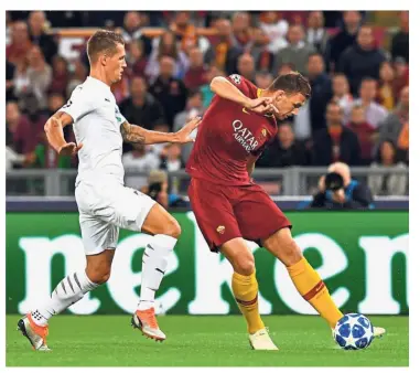  ?? — AFP ?? Going all out: AS Roma forward Edin Dzeko (right) scoring the opening goal against Viktoria Plzen during the Champions League Group G match at the Olympic Stadium in Rome on Tuesday.