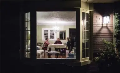  ?? AARON VINCENT ELKAIM/THE NEW YORK TIMES ?? Janet Barber, centre, with her daughters Sarah, left, and Jennifer, at their family home in Oakville. Janet and her husband haven’t joined the rush to sell their home; Sarah returned to live with them as she saves for a down payment.