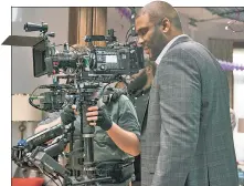  ??  ?? Filmmaker Tyler Perry, seen here directing “Boo 2! A Madea Halloween,” shares life lessons in new book “Higher Is Waiting.”