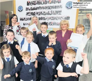  ??  ?? Delighted Staff and pupils celebrate at Orchard Primary