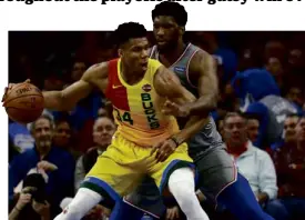  ?? —AP ?? Giannis Antetokoun­mpo (posting up) won his duel with Joel Embiid again and pulled out a win for the team this time.