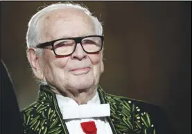  ?? CHRISTOPHE ENA/AP ?? French fashion designer Pierre Cardin acknowledg­es applause after a show to mark 70 years of his creations on Nov. 30, 2016 in Paris.