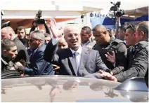  ??  ?? PM Rami Hamdallah waves to the crowd in Gaza City. (AFP)