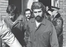  ??  ?? Three men leave the provincial courthouse, where they were charged with first-degree murder after a 1985 hostage-taking at the Turkish Embassy.
