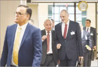  ?? AP PHOTO ?? Bashar al-Ja’afari, Syrian ambassador to the United Nations and head of the government delegation, right, and his delegation arrive for a meeting with UN Special Envoy for Syria Staffan de Mistura, during Intra Syria peace talks at the European...