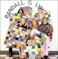  ?? COURTESY PHOTO ?? Members of the quilting crew in the EAST class at Lynch Middle School in Farmington display the five baby quilts they made and donated for the new Children’s Hospital in Springdale. Local quilter Kathy Garringer, right, was instrument­al in helping the...