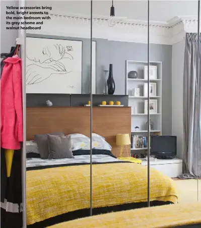  ??  ?? Yellow accessorie­s bring bold, bright accents to the main bedroom with its grey scheme and walnut headboard