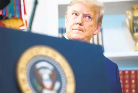  ?? SAULLOEB/GETTY-AFP ?? President Donald Trump distanced himself from a rejected Supreme Court challenge to Pennsylvan­ia’s election results before touting his involvemen­t in a new effort by Texas to overturn the election.