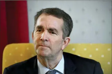  ?? KATHERINE FREY — THE WASHINGTON POST VIA AP ?? Virginia Gov. Ralph Northam talks during an interview at the Governor’s Mansion, Saturday in Richmond, Va. The embattled governor says he wants to spend the remaining three years of his term pursuing racial “equity.” Northam told The Washington Post that there is a higher reason for the “horrific” reckoning over a racist photograph that appeared in his medical school yearbook.