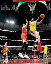  ?? MATT MARTON-USA TODAY SPORTS ?? LOS ANGELES LAKERS forward LeBron James (23) shoots the ball against Chicago Bulls forward Otto Porter Jr. (22) in the first half at the United Center.