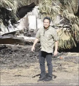  ??  ?? Olowalu resident Hinano Rodrigues walks near the destroyed Olowalu Lanakila Hawaiian Church’s social hall Monday. Rodrigues said he saw the fire after it started high on the hillside beneath power lines. “We have fires every year,” Rodrigues said, adding that the speed with which this one reached the small neighborho­od was a surprise. “You grow up in Olowalu, you get used to wind and dust and fires and low water pressure.”