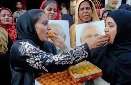  ?? — PTI ?? Muslims women celebrate the Supreme Court’s decision on ‘triple talaq’ in Mumbai on Tuesday.