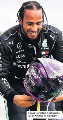  ??  ?? Lewis Hamilton is all smiles after winning in Hungary