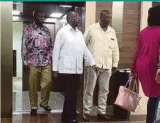  ??  ?? Zimbabwe’s former president Robert Mugabe (centre) walking out of a lift at the Gleneagles Hospital in Singapore yesterday.