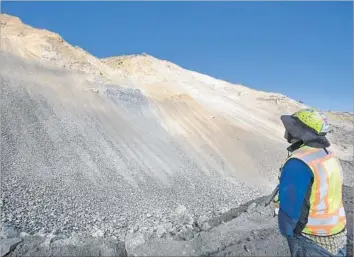  ?? Brian van der Brug Los Angeles Times ?? JOHN DUFFY, an engineerin­g geologist and avid surfer, looks at the massive Mud Creek landslide in Big Sur, which buried Highway 1. With autumn’s big surf coming, he and others are concerned about erosion.