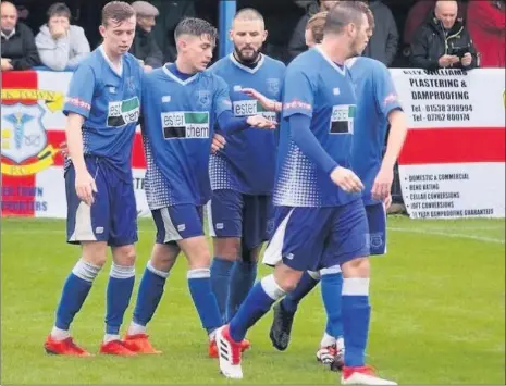  ??  ?? Leek Town’s Dan Trickett-smith, second left, celebrates his first goal against Charnock Richard with team-mates. Blues went on to win the game 3-2. Picture and report: Steve Reynolds