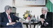  ?? Brendan Smialowski/getty Images ?? U.S. Secretary of State John Kerry, left, met Palestinia­n president Mahmoud Abbas in the West Bank city of Ramallah on Friday.