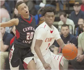  ?? HERALD FILE PHOTO ?? MAJOR MILESTONE: Everett’s Ghared Boyce (right) eclipsed 2,000 career points yesterday, scoring 15 as the Tide cruised past Waltham, 84-51.