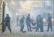  ?? REUTERS ?? Afghan policemen carry an injured man after the blast.