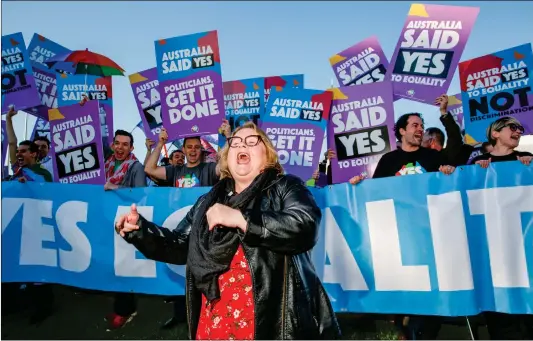  ?? Photo: AFP ?? Australian TV actress Magda Szubanski dances in front of equality ambassador­s and volunteers from the Equality Campaign in front of Parliament House in Canberra on Thursday, ahead of the parliament­ary vote on same-sex marriage.