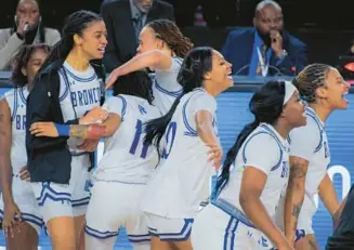  ?? ?? The Fayettevil­le State women react as the final seconds tick away in their 64-59 win over defending champion Elizabeth City State.