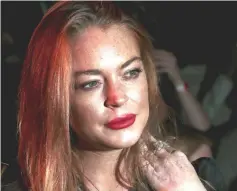  ??  ?? Lohan attends the London Fashion Week in London, on Sept 19, 2015. — Reuters file photo