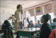  ?? John Moore / Getty Images ?? Third grade literacy instructor Katelyn Battinelli talks with students last Wednesday about their pandemic-related fears on the first day of in-person learning for five days per week at Stark Elementary School in Stamford.