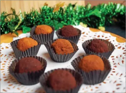  ?? PHOTO BY EMILY RYAN ?? At Bridge Street Chocolates in Phoenixvil­le, choose from traditiona­l or “extra-dirty Irish potatoes,” rolled in cinnamon and cocoa.