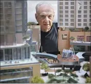  ?? Jay L. Clendenin Los Angeles Times ?? FRANK GEHRY is framed by a model of his Grand Avenue project, scheduled to be done next year.