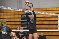  ?? ?? Darien’s Aubrey Moore sends the ball over the net against Trumbull during the FCIAC girls volleyball final at Fairfield Ludlowe on Nov. 4.