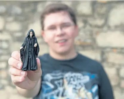  ??  ?? Hunor Deak with a Star Wars model of evil Emperor Palpatine.