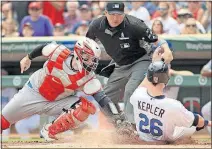  ?? ASSOCIATED PRESS] [ANDY CLAYTON-KING/THE ?? Indians catcher Roberto Perez tags out the Twins’ Max Kepler in the second inning.