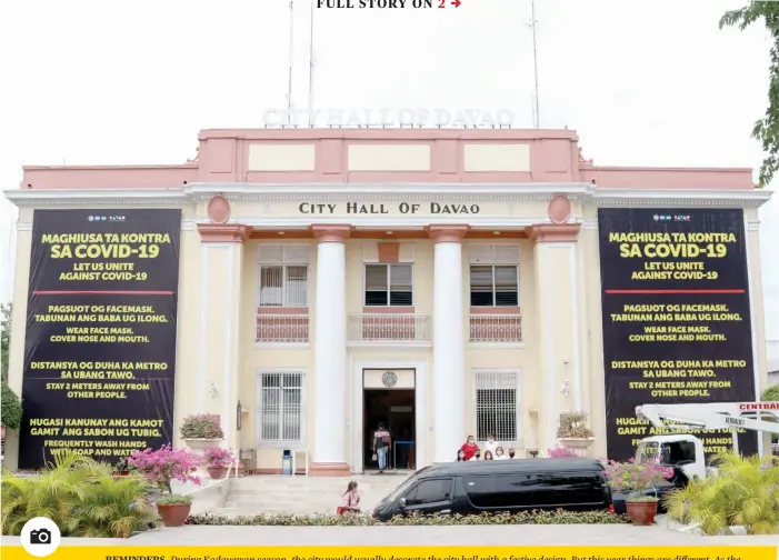  ?? PHOTO BY MARK PERANDOS ?? REMINDERS. During Kadayawan season, the city would usually decorate the city hall with a festive design. But this year things are different. As the city enters a modified general community quarantine (MGCQ), the city reminds the public to observe basic health safety measures to prevent a surge in Covid-19 cases in the region.