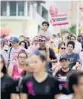  ?? MIKE STOCKER/SOUTH FLORIDA SUN SENTINEL ?? Participan­ts walk down Las Olas Boulevard in Fort Lauderdale during the Making Strides Against Breast Cancer 5k walk in 2019. Events continue throughout October.