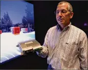 ??  ?? Shapiro holds the company’s Nvidia Drive PX2 processor. Known for making processors for video games, Nvidia makes the “brains” behind most self-driving cars today.