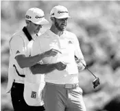  ?? MATT YORK/ASSOCIATED PRESS ?? Dustin Johnson, right, shot a 7-under 66 to build a 2-shot lead Saturday in the Sentry Tournament of Champions.