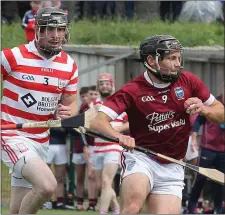  ??  ?? Mark Maloney of St. Martin’s steals a march on John Breen.