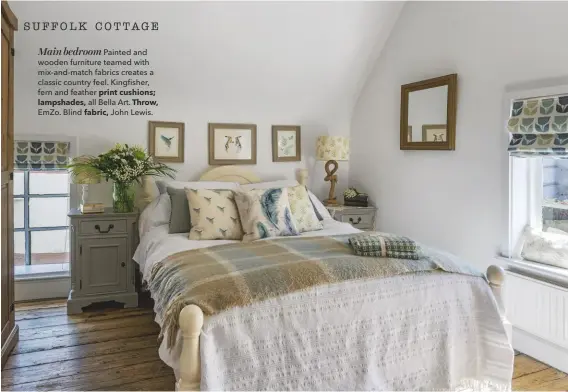  ??  ?? Main bedroom Painted and wooden furniture teamed with mix-and-match fabrics creates a classic country feel. Kingfisher, fern and feather print cushions; lampshades, all Bella Art. Throw, Emzo. Blind fabric, John Lewis.