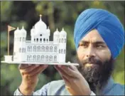  ??  ?? A paper artist shows a model of Kartarpur Sahib, the final resting place of Guru Nanak, in Amritsar on Thursday. SAMEER SEHGAL/HT