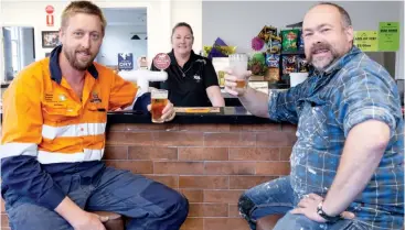  ??  ?? A quick beer after the working day was in order for Nick Robinson and Dougie Donald last week, who are pleased to see the pub’s re-opening by publican Lisa Robinson (centre).