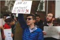  ?? (Mike Segar/Reuters) ?? STUDENTS FROM Rambam Mesivta-Maimonides High School protest outside the home of Jakiw Palij in New York City’s Queens borough in April 2017.