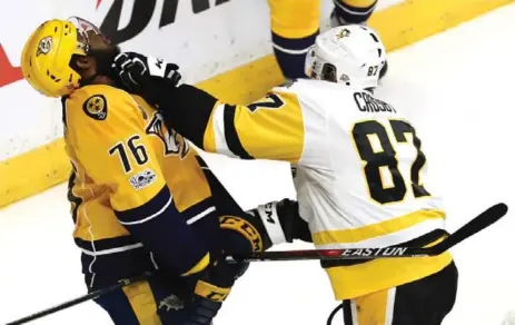  ?? BRUCE BENNETT/GETTY IMAGES ?? Nashville’s P.K. Subban takes one on the chin from Pittsburgh’s Sidney Crosby in Game 4 on Monday night. There’s a little history there.