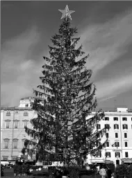  ?? ALBERTO PIZZOLI / AGENCE FRANCE-PRESSE ?? The controvers­ial Christmas tree, known as ‘Baldy’, is pictured at the Piazza Venezia in Rome, Italy, on Tuesday. The tree has become a laughing stock among residents.