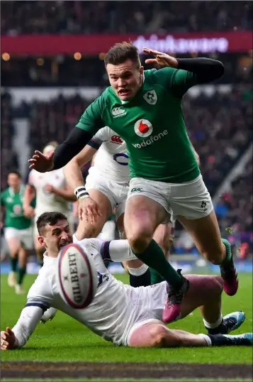  ??  ?? Jacob Stockdale on his way to scoring Ireland’s third try against England.