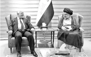  ??  ?? Abadi (left) meets with Sadr in Baghdad. — AFP photo