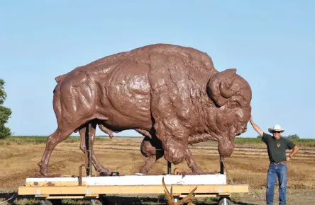  ??  ?? Richard Loffler next to one of the unfinished works from his monument Buffalo Trail. The finished work now sits in front of the National Museum of Wildlife Art in Jackson Hole, Wyoming.