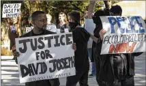  ?? RODOLFO GONZALEZ / AMERICAN-STATESMAN 2016 ?? Chas Moore (left) participat­es in a protest of the killing of a naked, unarmed 17-year-old by an Austin police officer in February 2016. A nonprofit organizati­on could help train police in de-escalation methods, a reader writes.